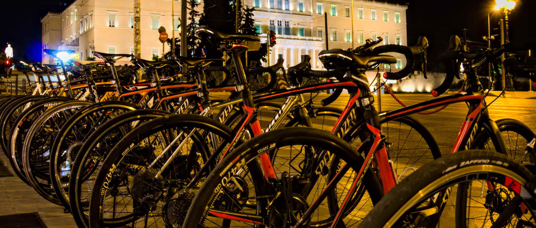 Road bikes on Syntagma square in Athens, Greece with the parliament in the background.